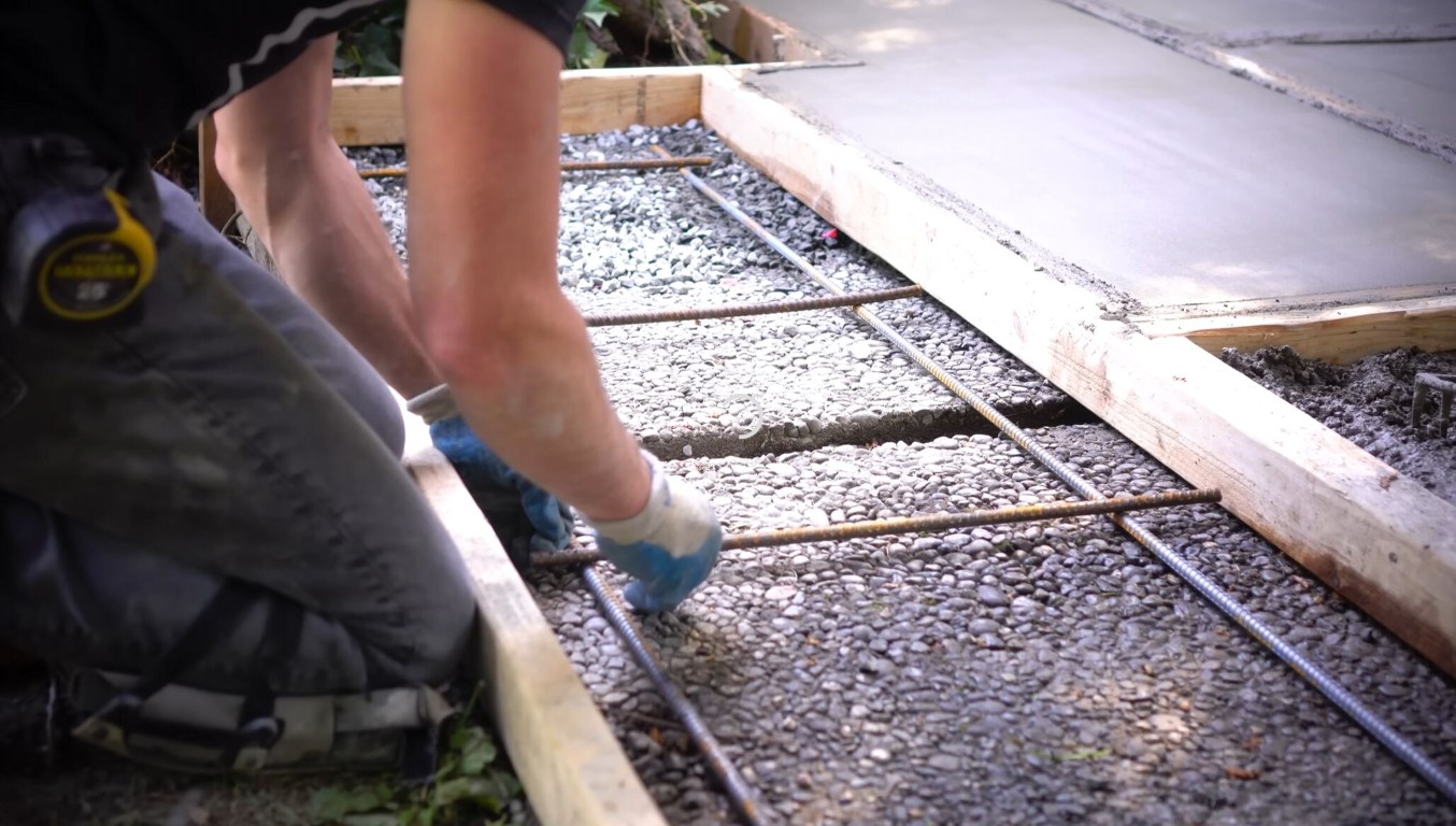 Proper concrete foundation preparation with rebar reinforcement